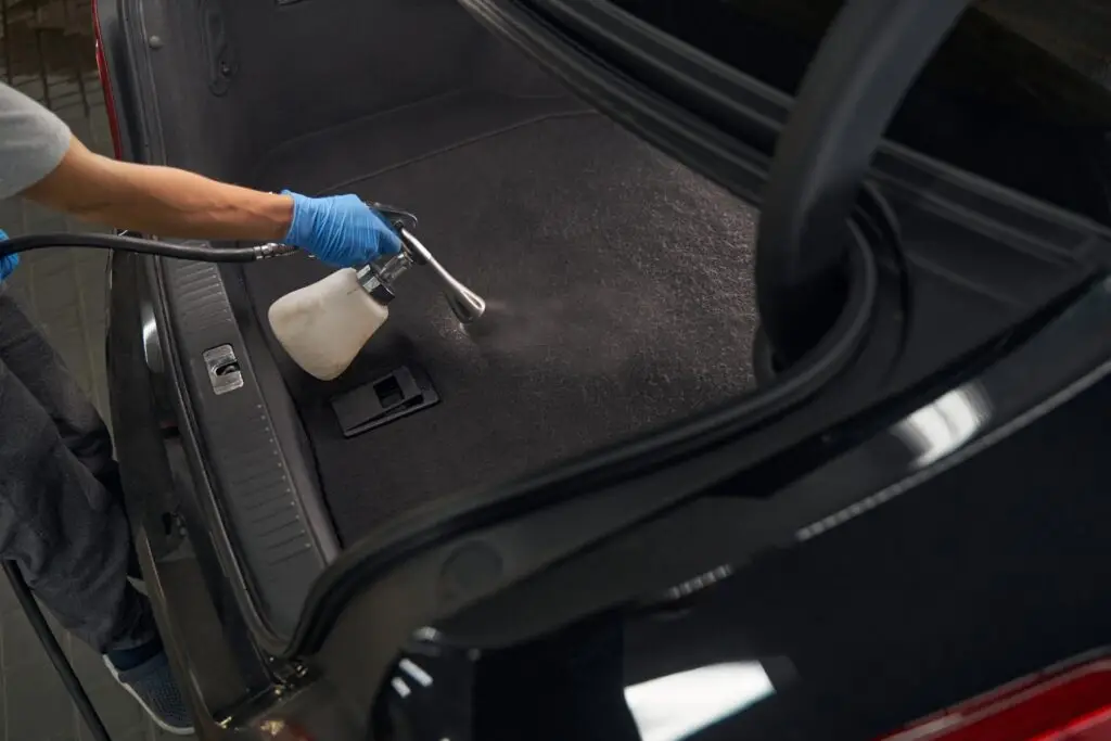 car detailer washing modern vehicle interior with 2024 10 22 10 06 43 utc 1 1
